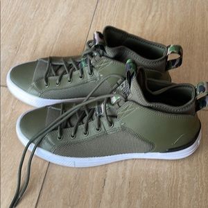 Converse limited edition army green camouflage high top sneakers. Men size 9.5